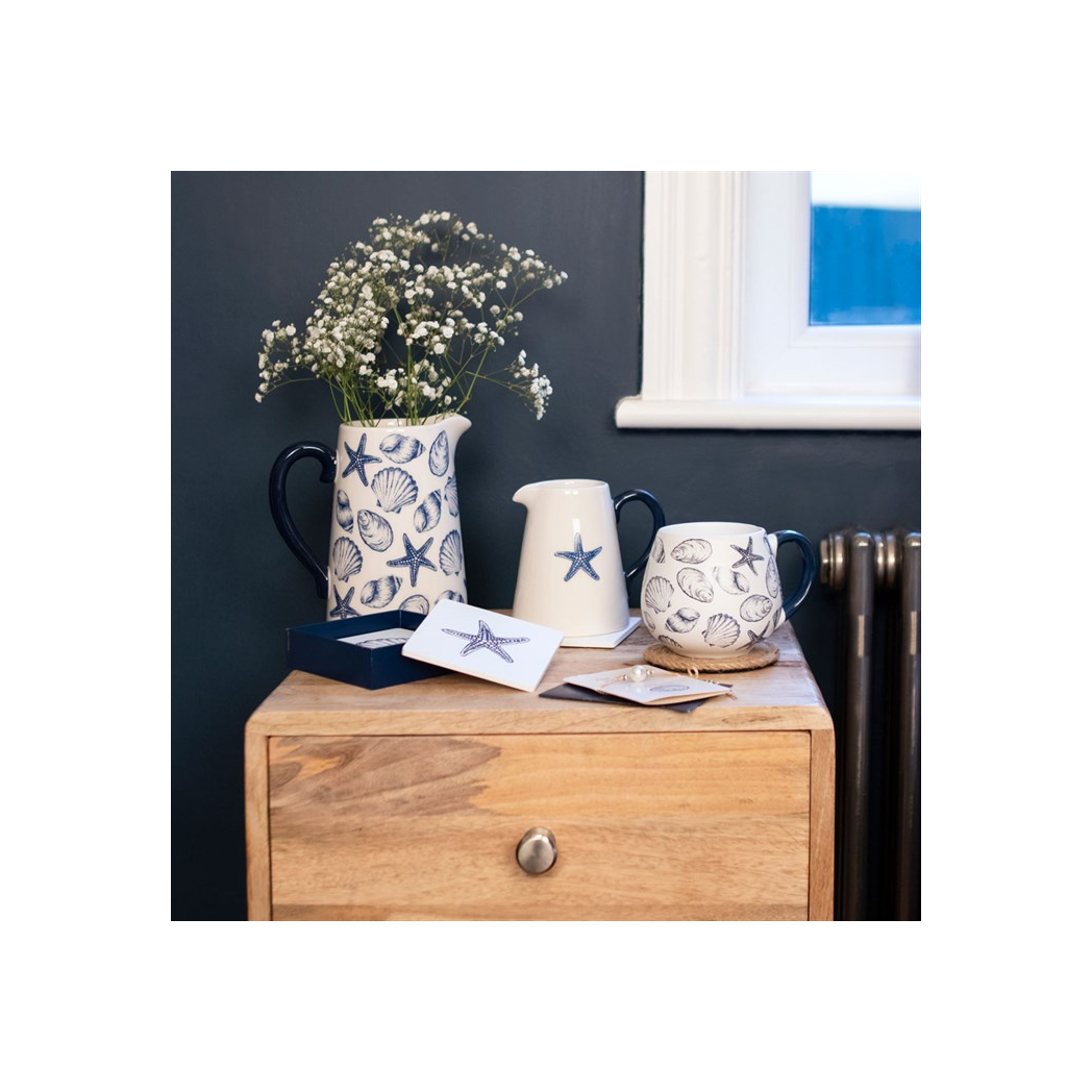Coastal ceramic flower jug with seashell design