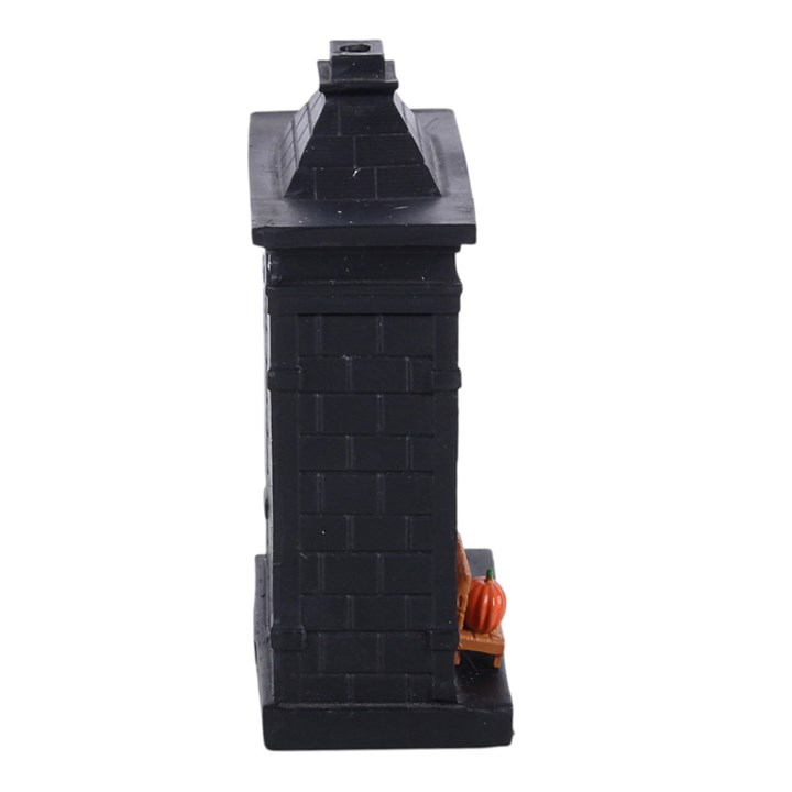 Spooky bookish incense cone holder with haunted library design