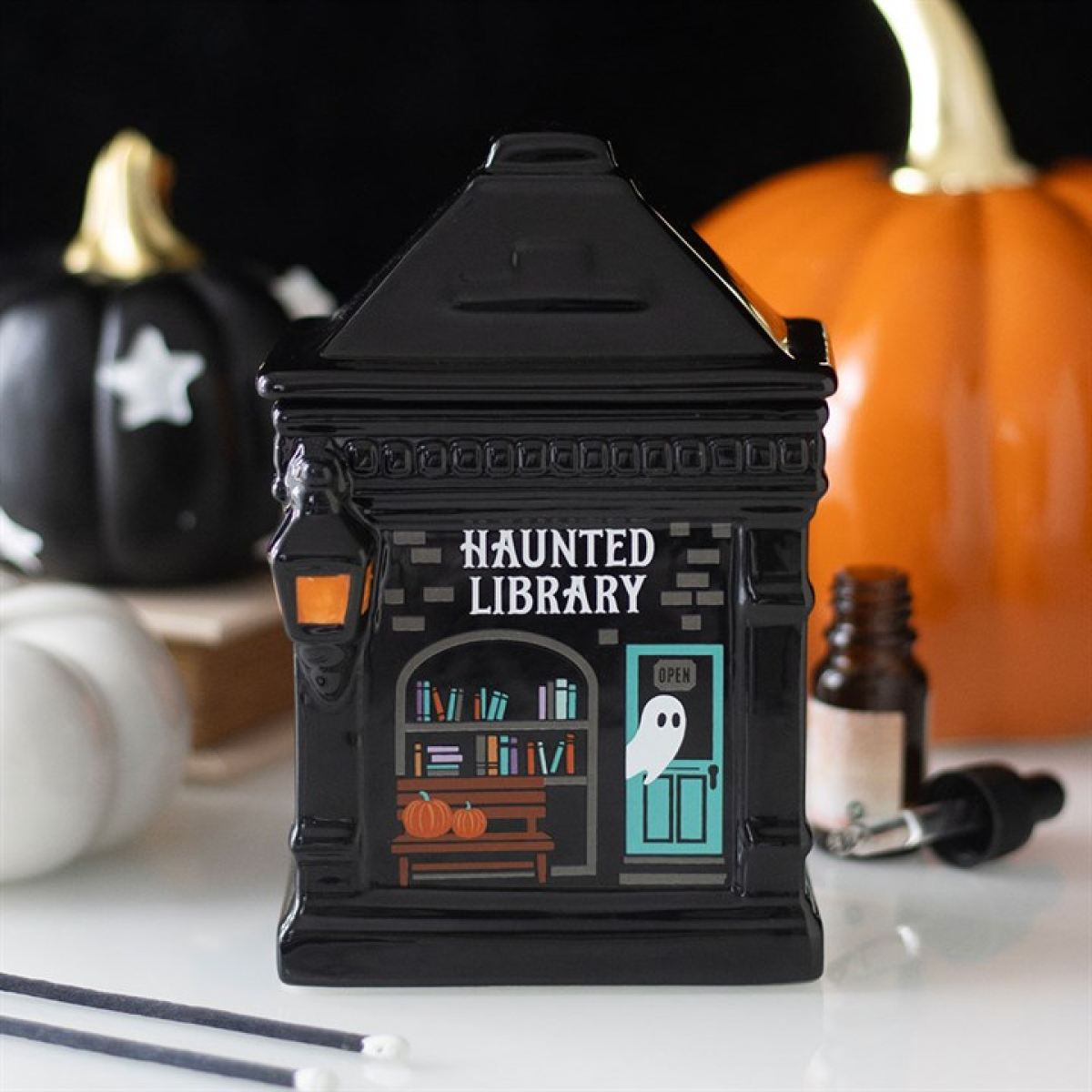 Haunted Library ceramic oil burner with spooky book details